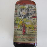 2 amber glass bottles with their old labels