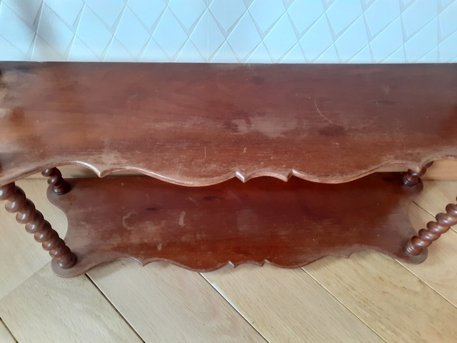 Turned wooden wall shelf