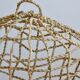 Suspension fishing net braided in palm leaf