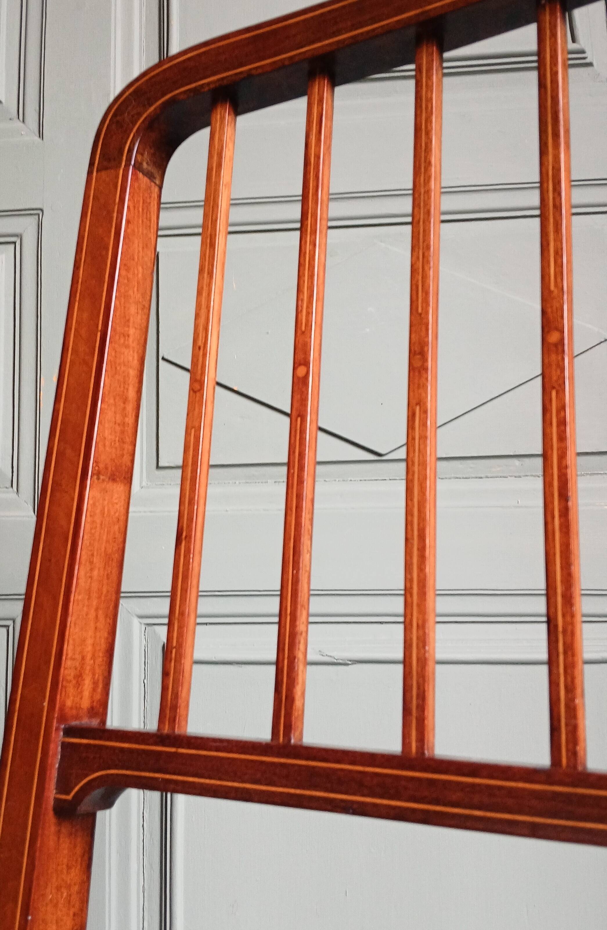 Pair of caned mahogany chairs, circa 1930.