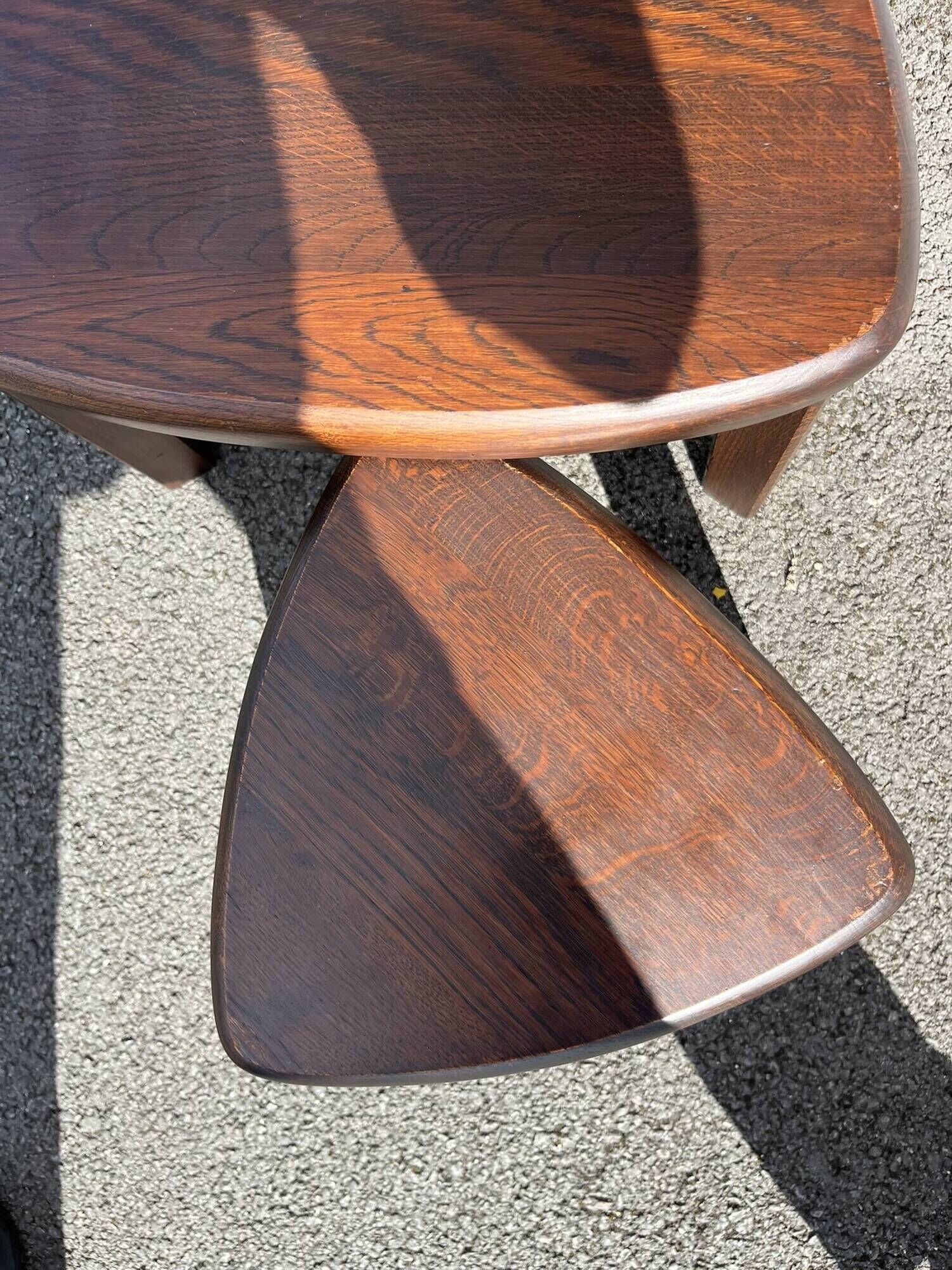 Nested tripod tables made of solid wood, in a modernist brutalist style.