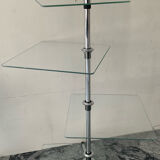 A pair of vintage side tables in glass and chrome metal.