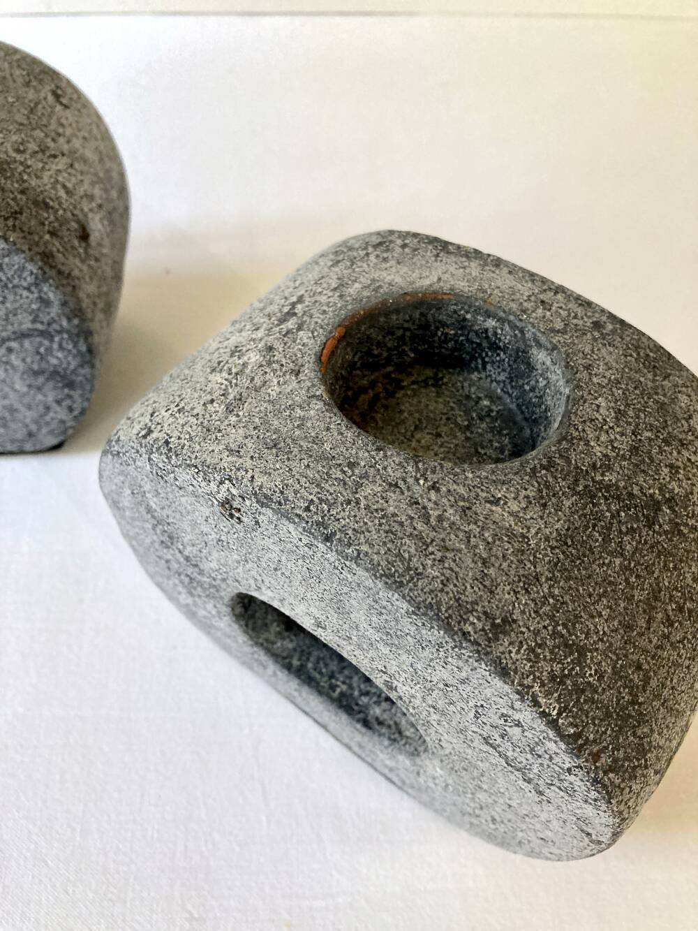 Pair of terracotta candle holders with anthracite finish, 1980s.