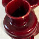 Ruby red ceramic pocket ashtray from Vallauris, numbered.