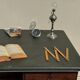 Modernist desk in wood and green moleskin upholstery