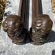 Pair of antique cast iron fire dogs "The Conquering Love"
