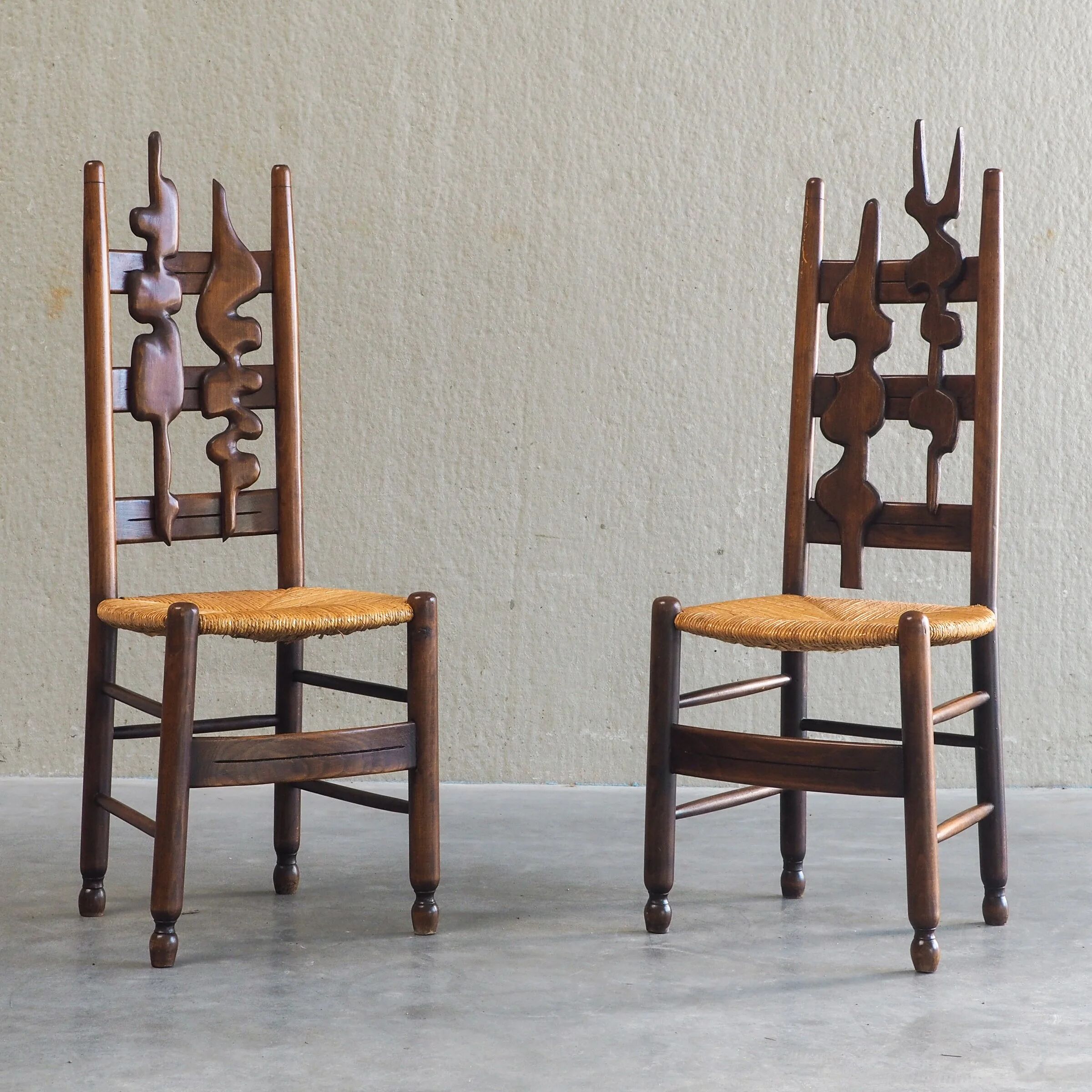 2 sculptural brutalist high-back chairs