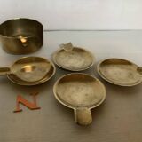 Four individual brass ashtrays