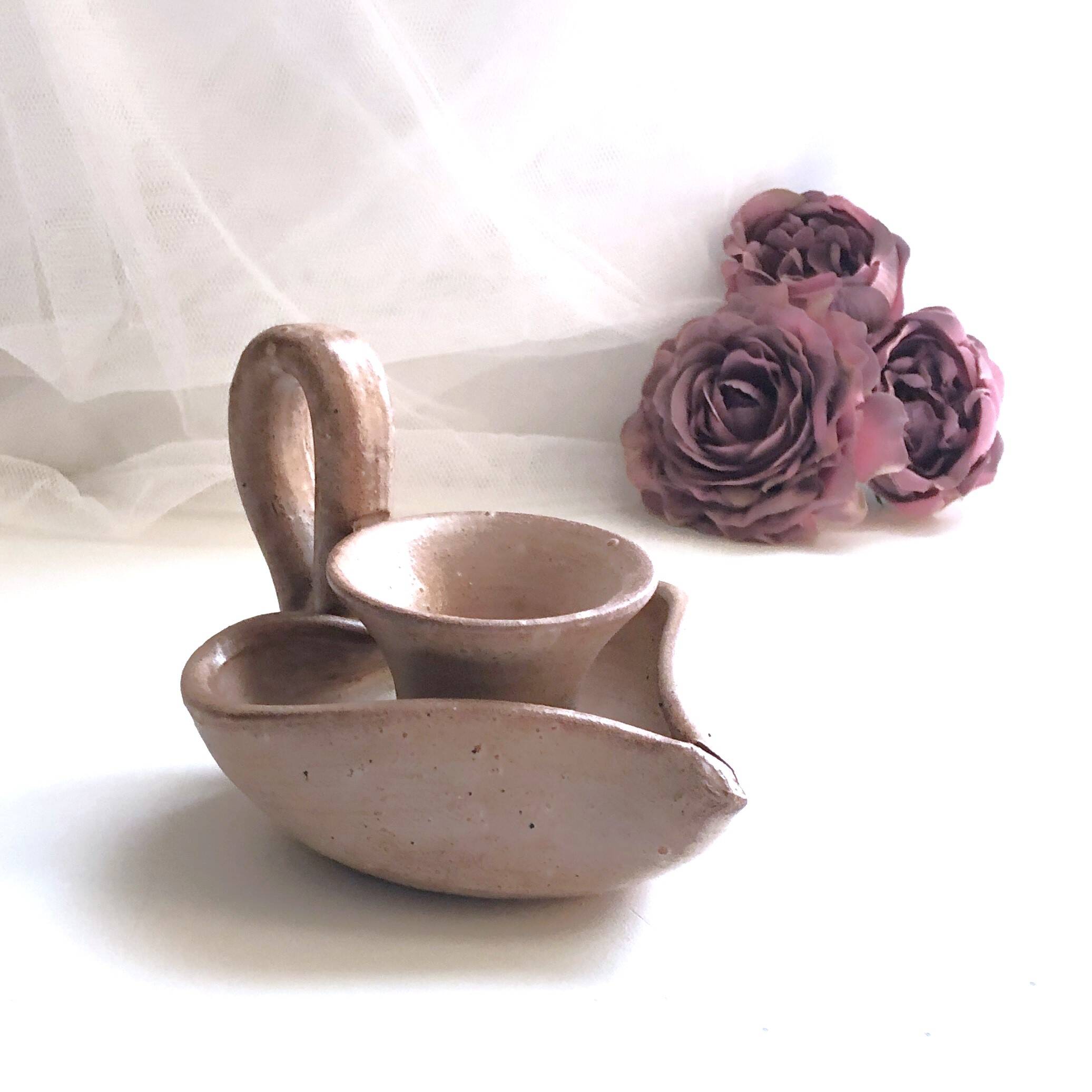 Glazed stoneware heart-shaped hand candle holder