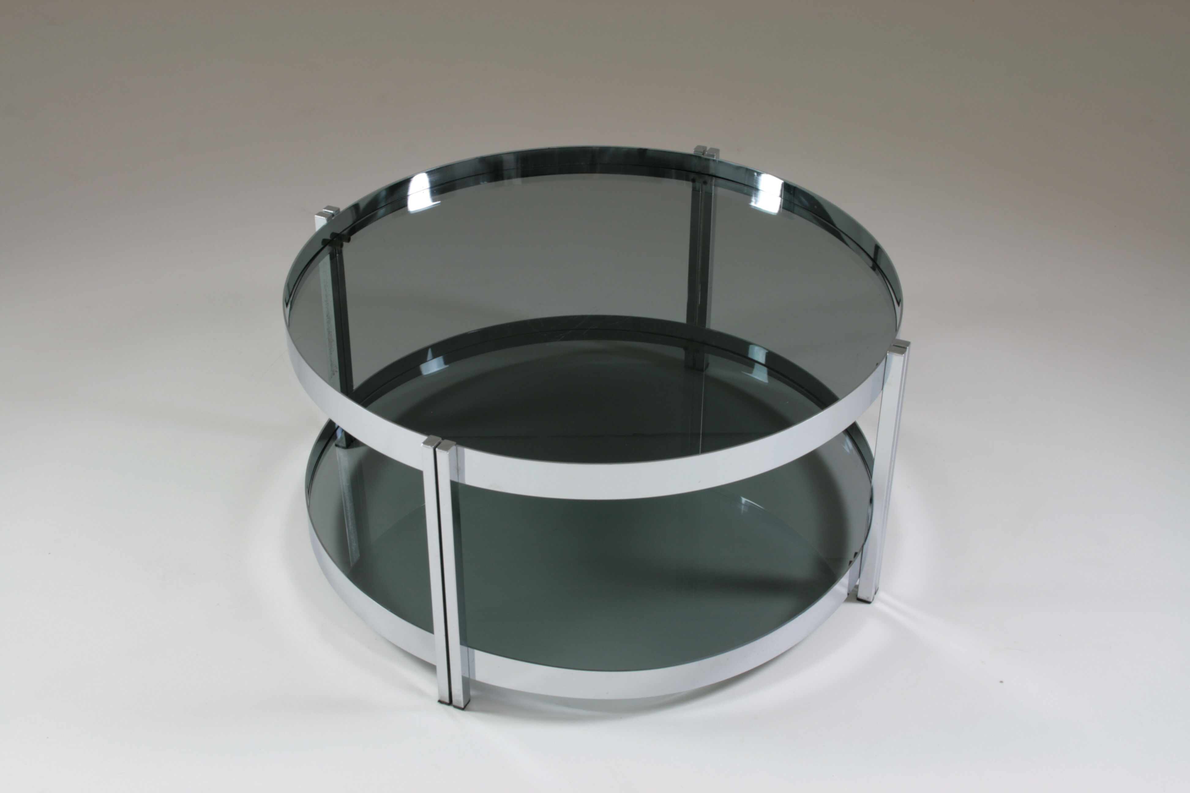 Round chrome-plated metal coffee table and smoked glass tops, France 1970s