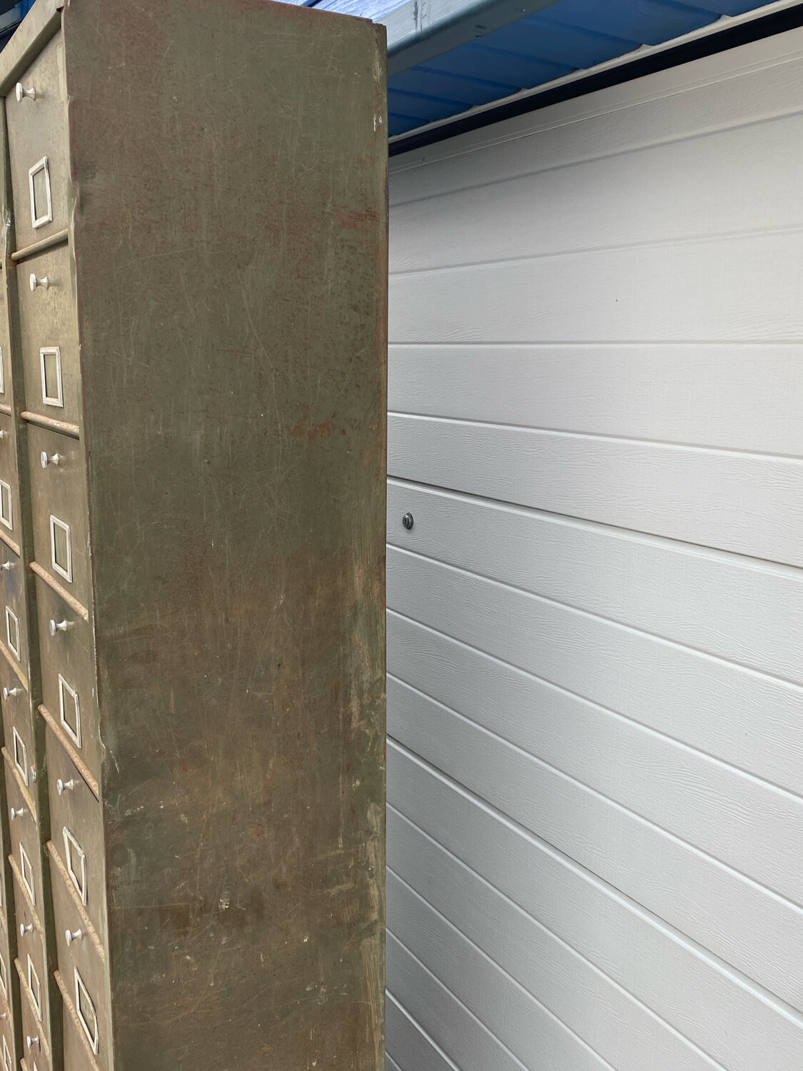 Military metal cabinet with hinged door