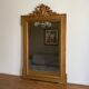 Miroir doré fin 19ème avec  fronton décoré, 115x70cm