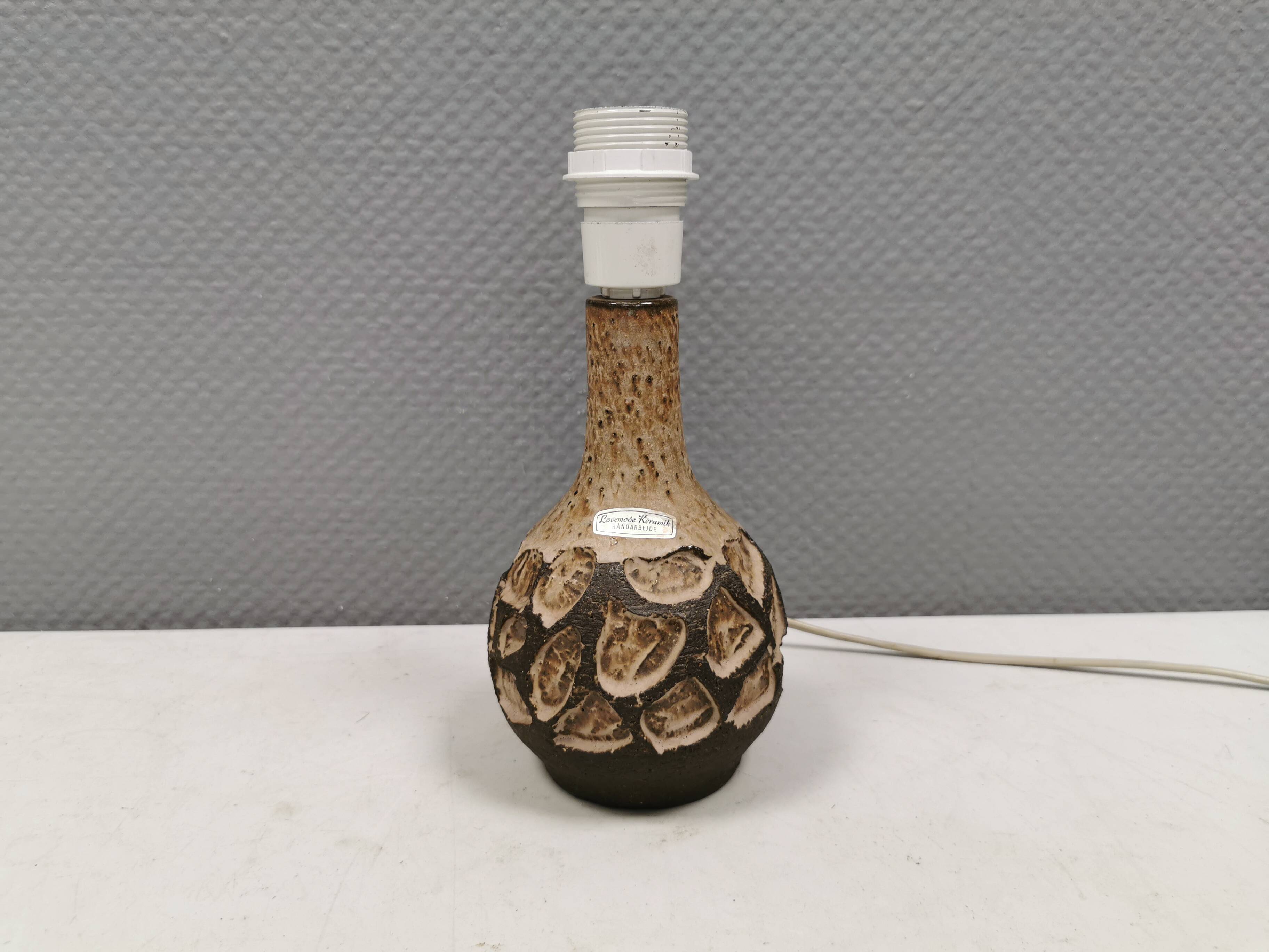 Small beautiful ceramic table lamp in earth colors.