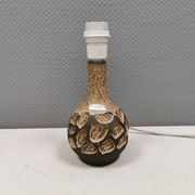 Small beautiful ceramic table lamp in earth colors.