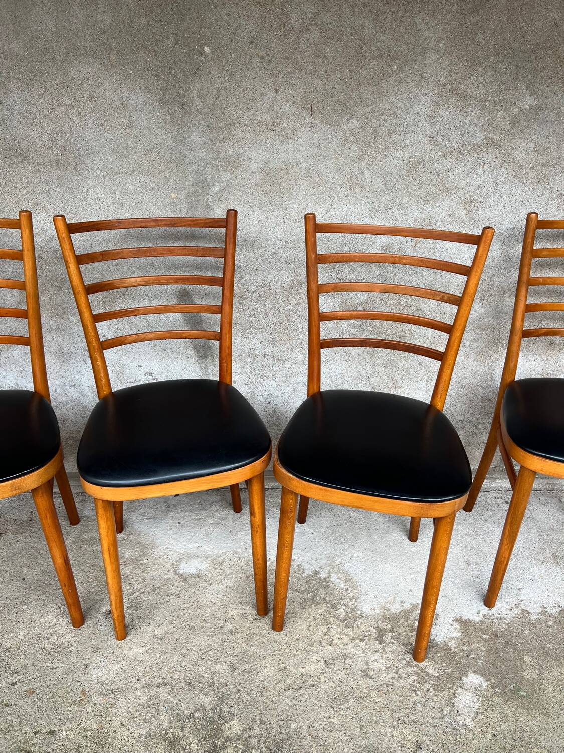 Set of 4 vintage wooden chairs with faux leather.