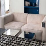 Beige corduroy two-seater sofa