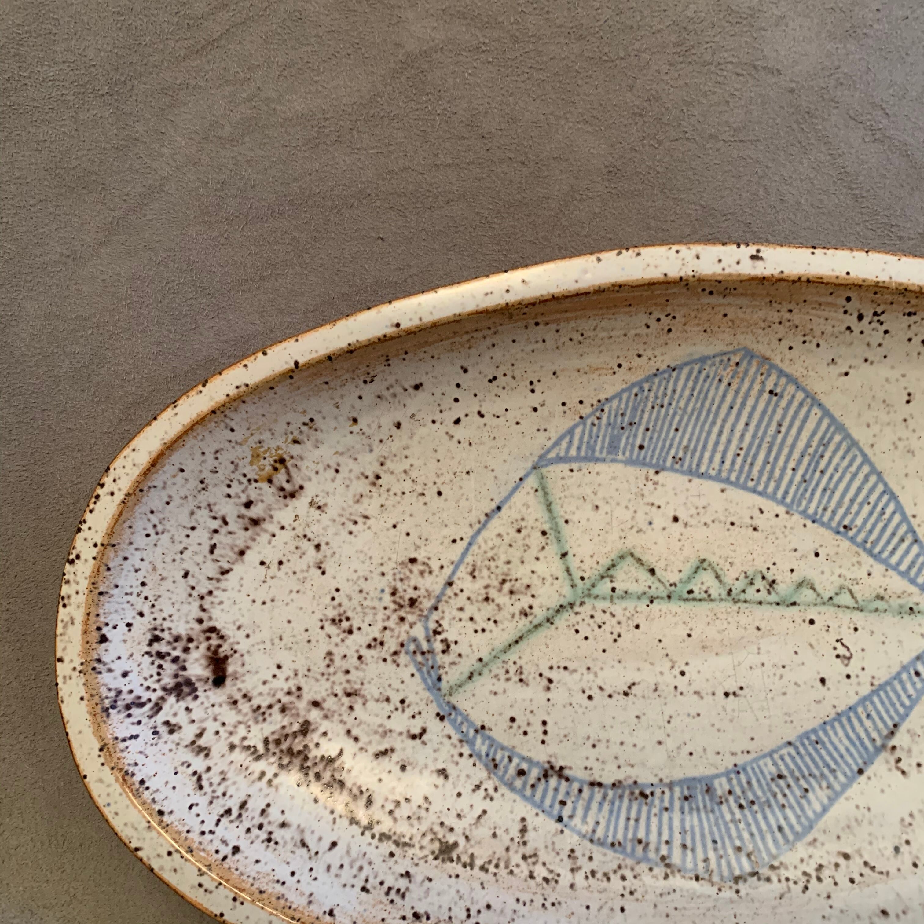 Terracotta /sandstone dish signed with fish drawing