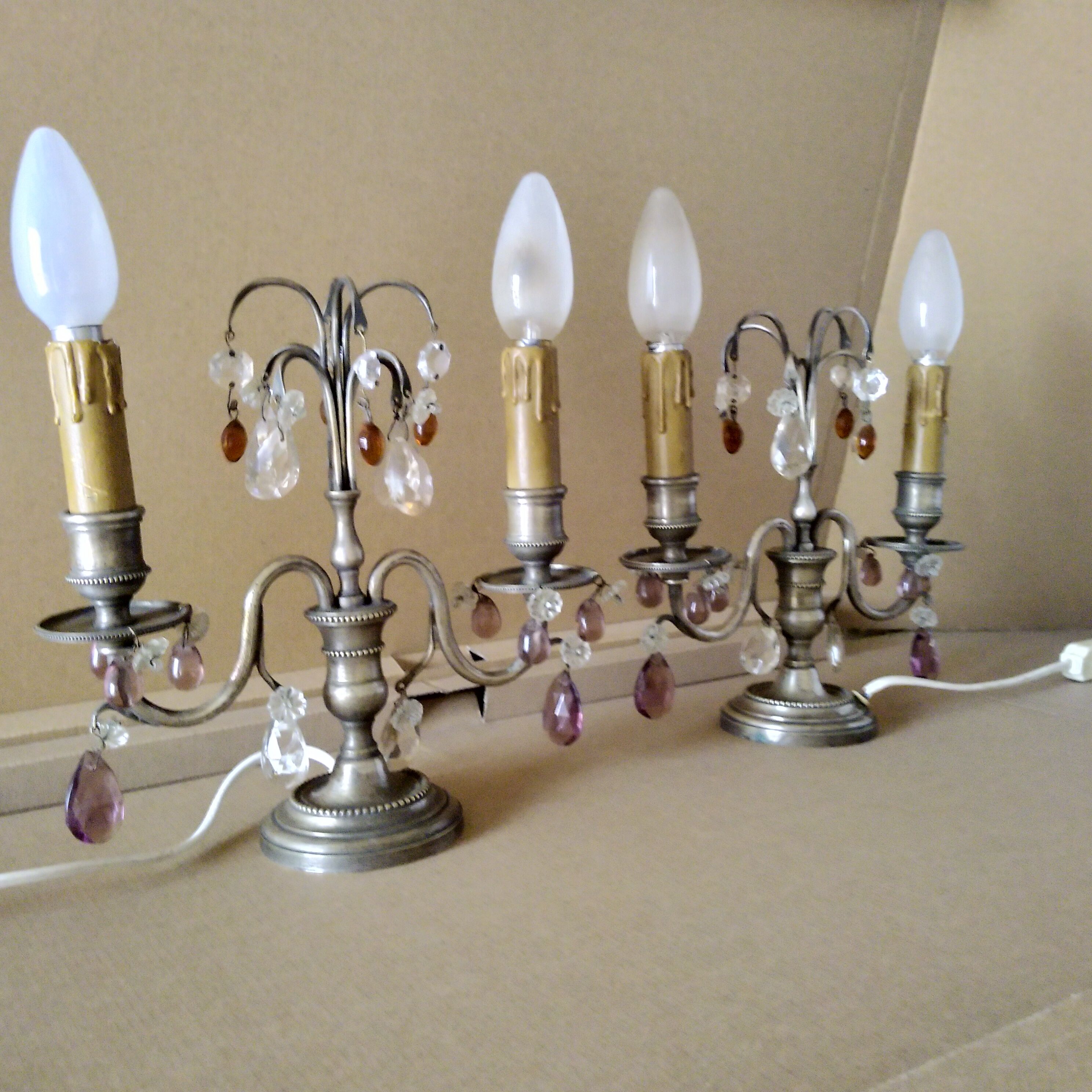 Pair of girandole lamps and silver metal