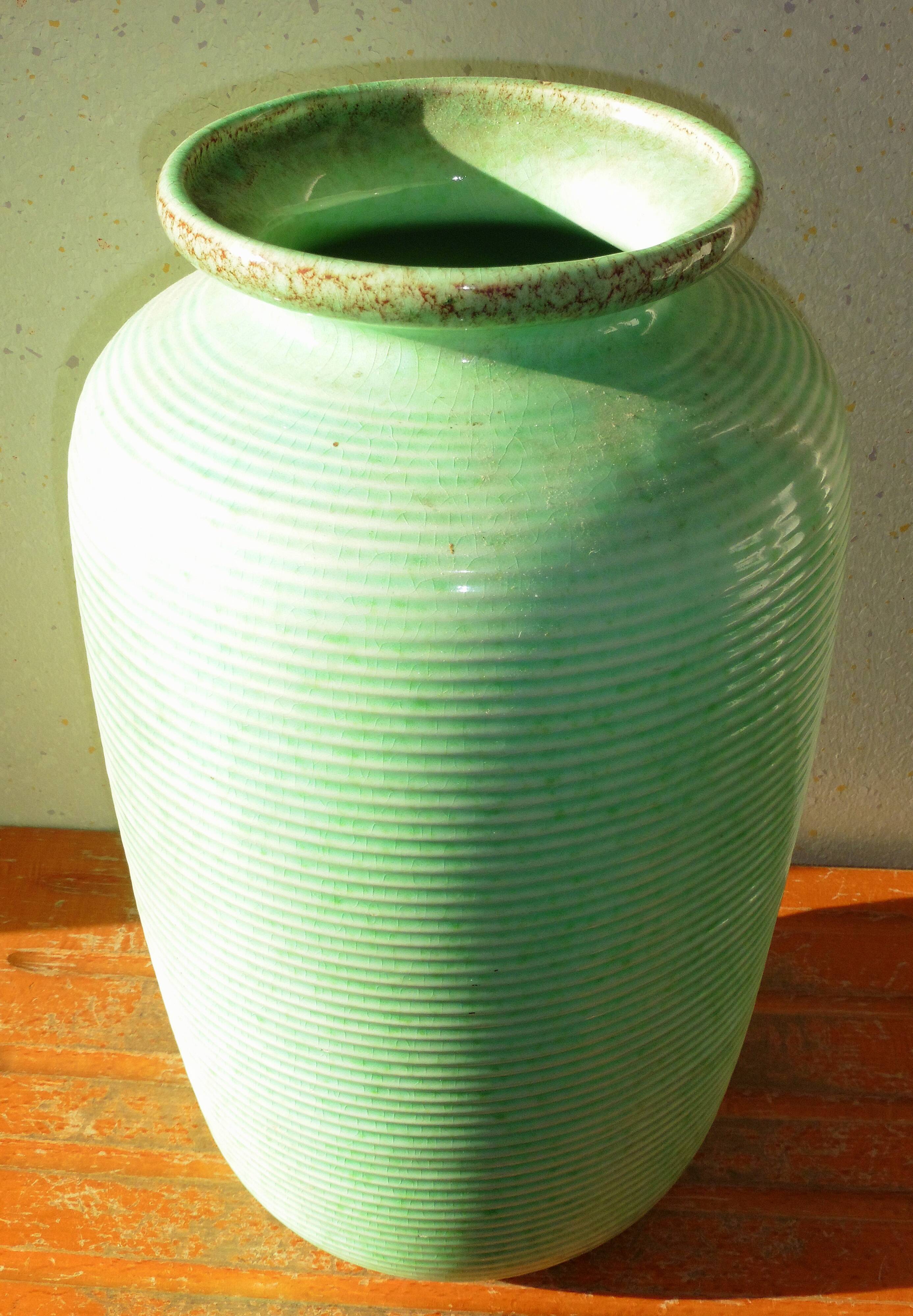 Enamelled earthenware vase with striated pattern