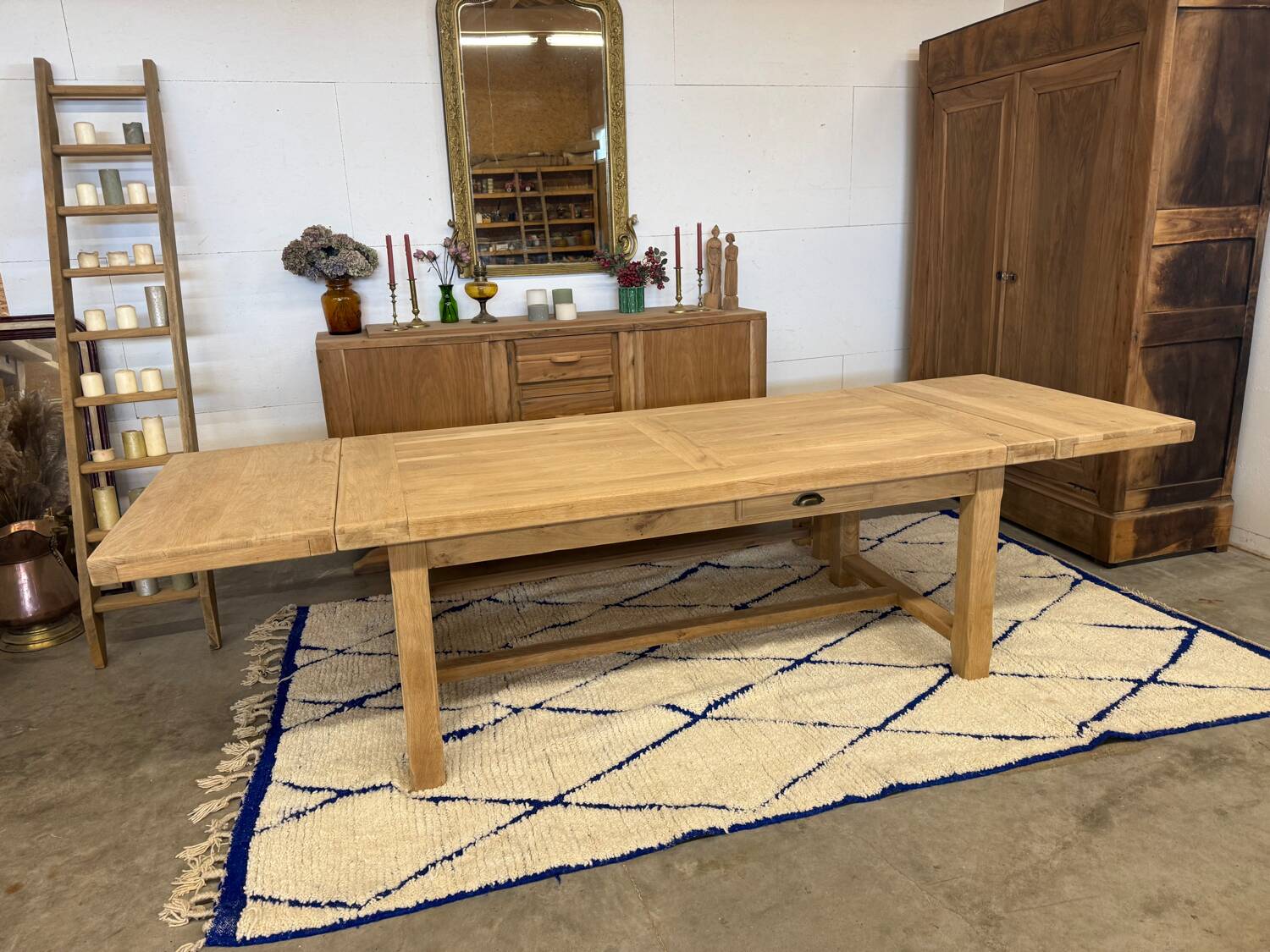 Solid oak extendable farmhouse table with 2 drawers.