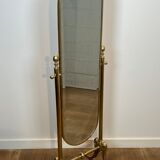 Pair of brass cheval mirrors in neoclassical style