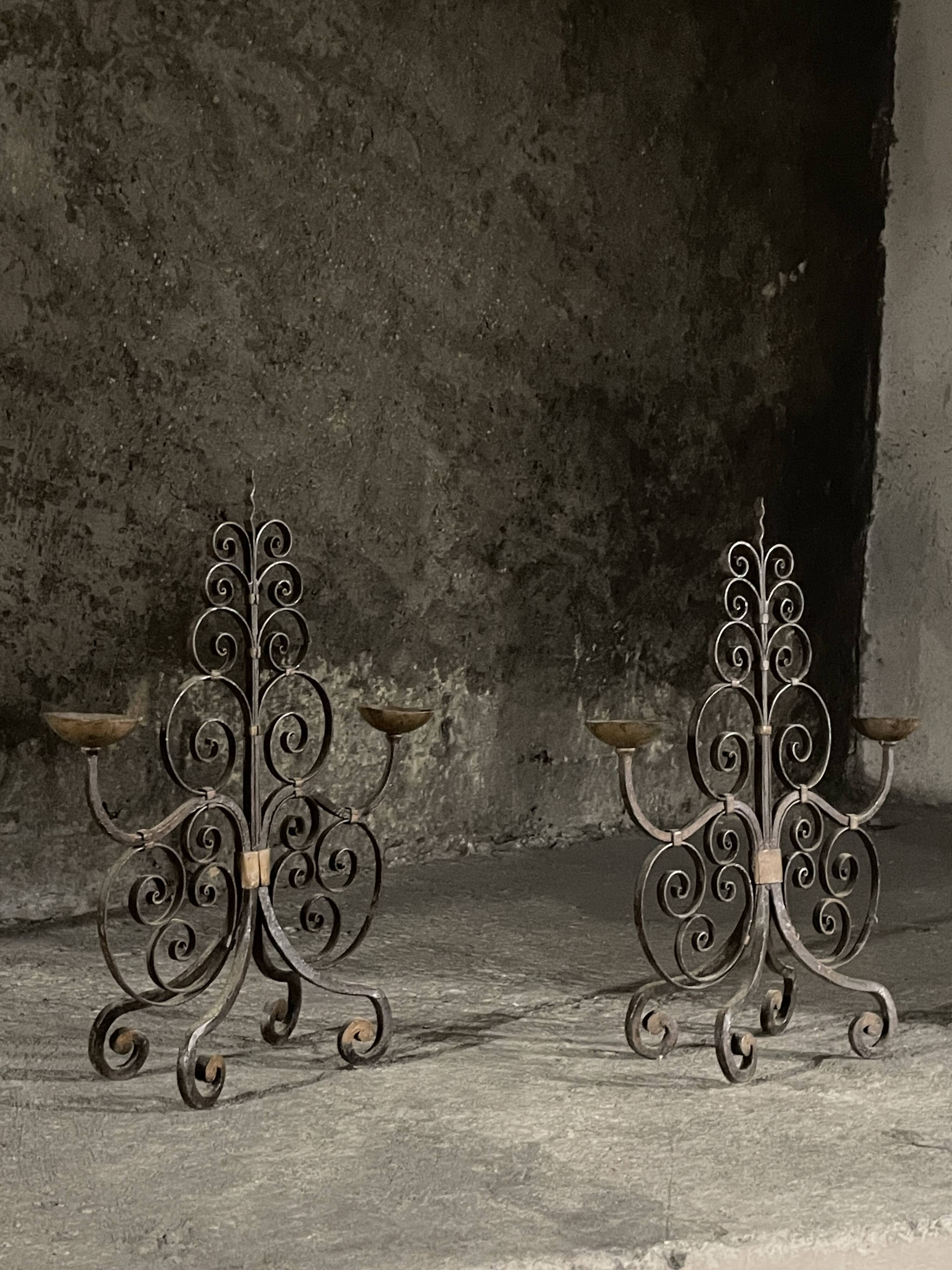 Pair of French wrought iron candelabra from the 19th century.