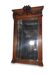 Bevelled mirror in carved wood