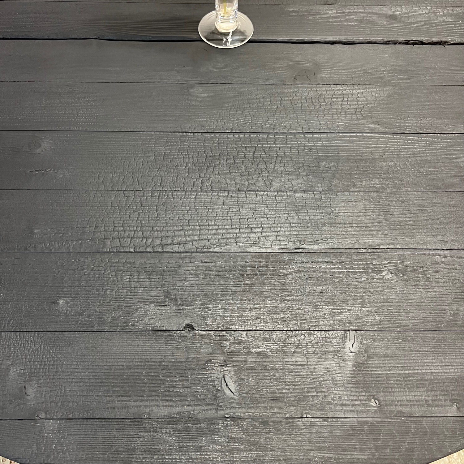Brutalist round table in burnt wood yakisugi