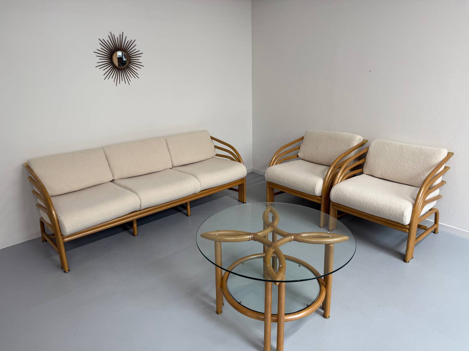 Complete living room with rattan sofa and white bouclette, brass finish, 80's design