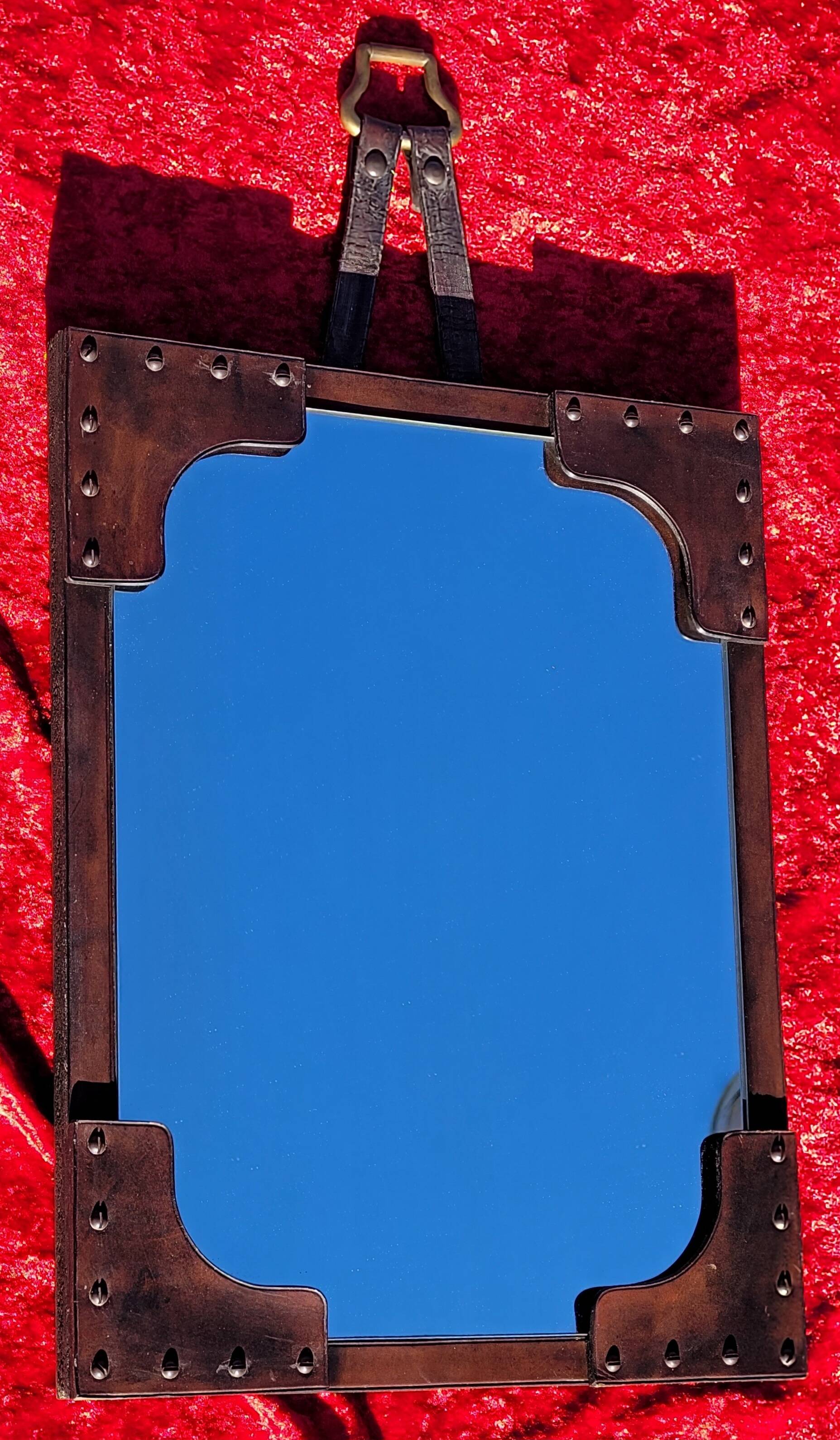 Leather-covered wall mirror attributed to Jacques Adnet 1950