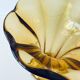 Ancient tulip vase in amber glass