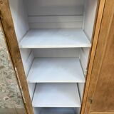 Display cabinet with hanging space
