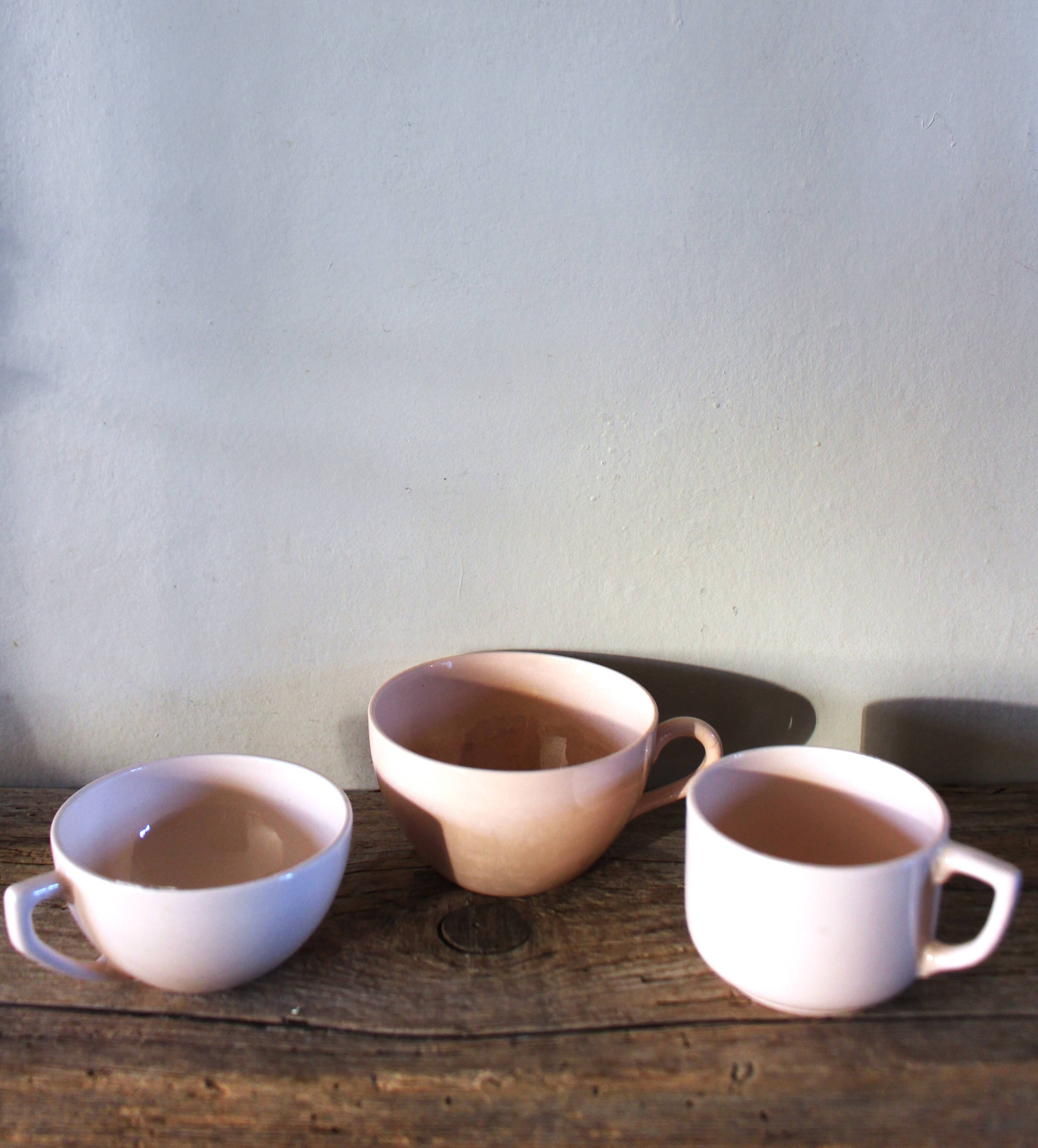 A set of 3 pink earthenware cups from Digoin Sarreguemines.