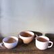 A set of 3 pink earthenware cups from Digoin Sarreguemines.