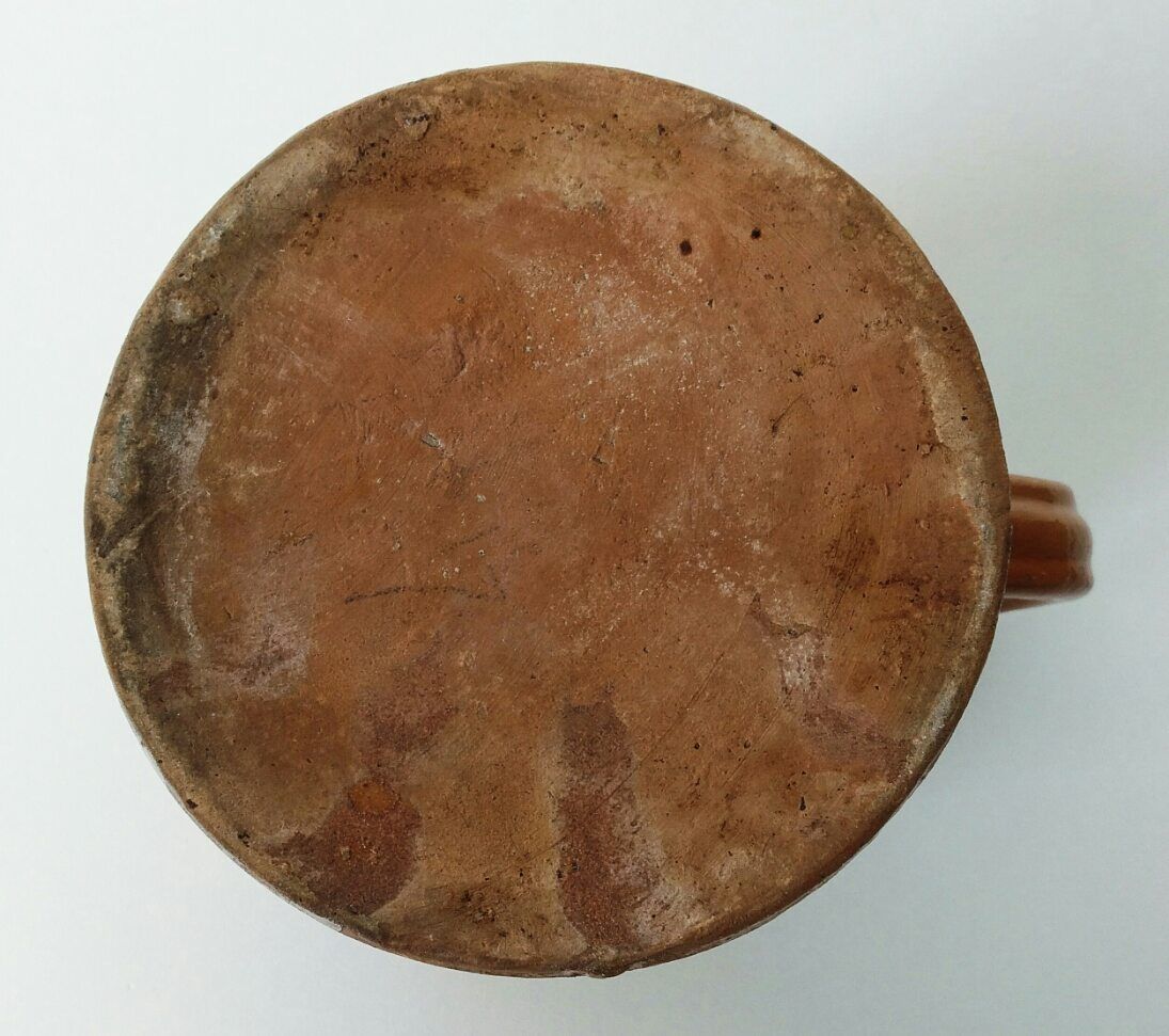 Old pitcher pot in glazed earth