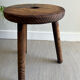 Three-legged wooden stool