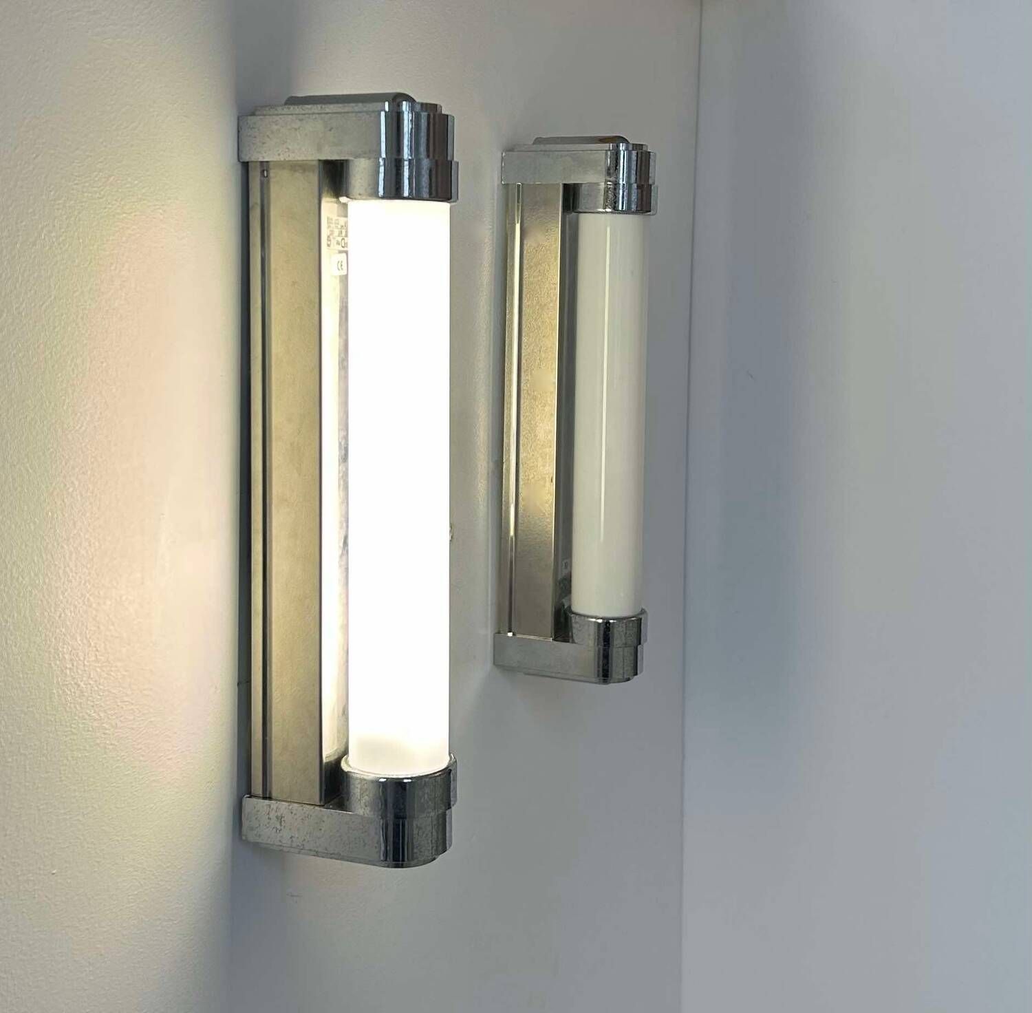 Pair of vintage wall lights, chromed metal, Italy 1970