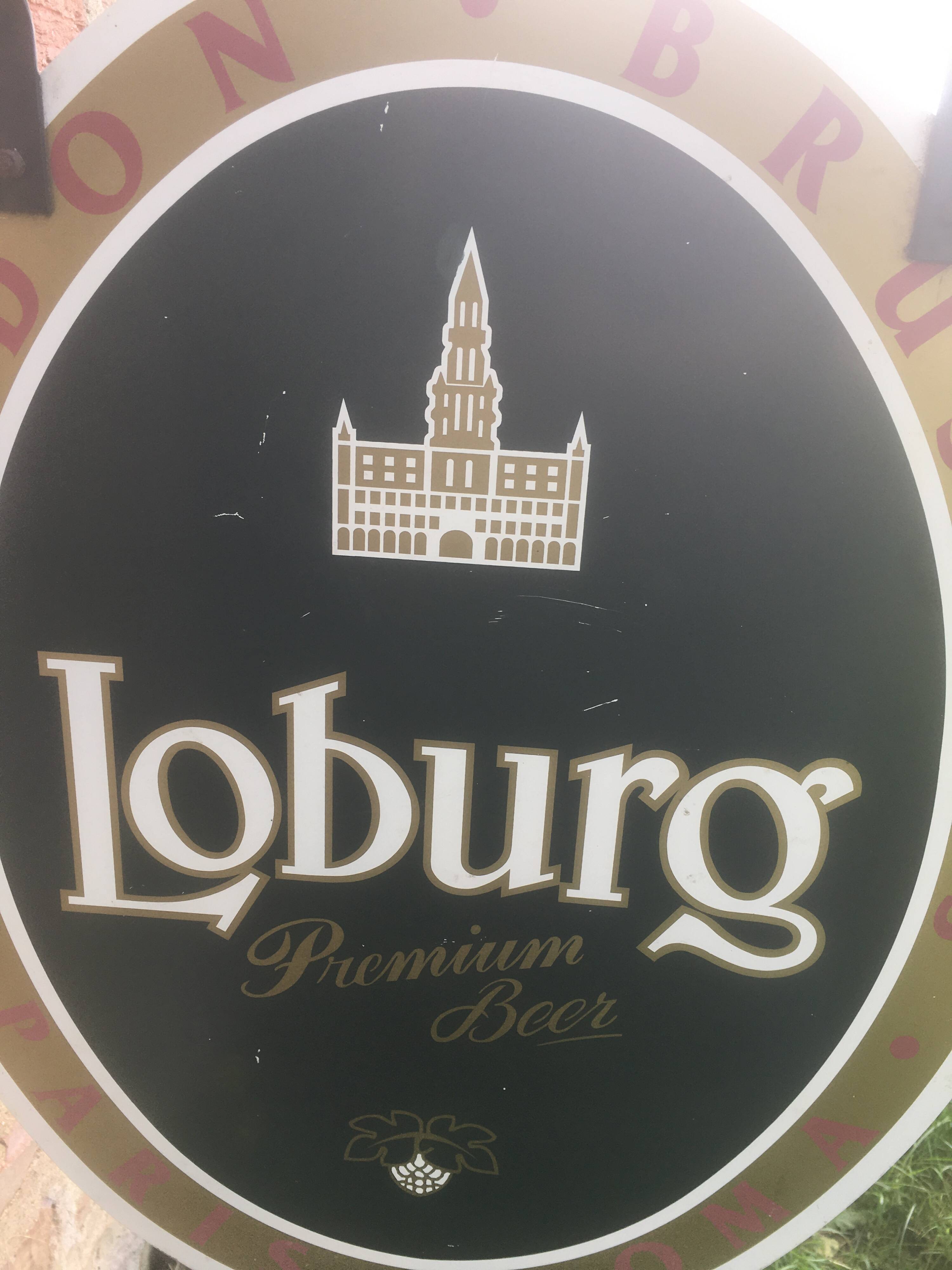 Double-sided "Loburg Beer" metal sign on wrought iron bracket