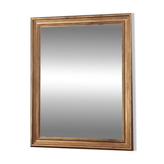 Large gold-framed mirror with bevelled glass.