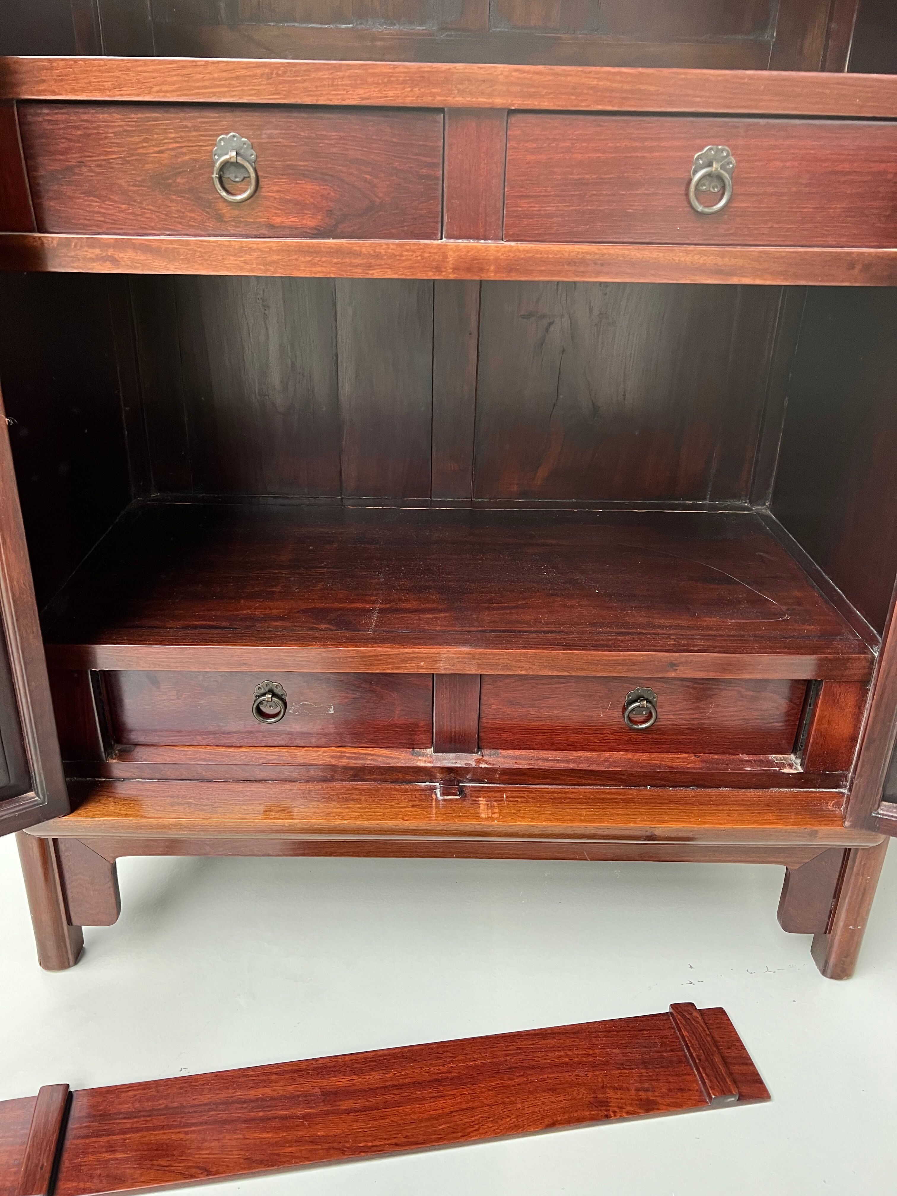 Chinese trapezoidal roller cabinet, made of rosewood.