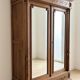 Antique wardrobe with 2 mirror doors in polished wood.