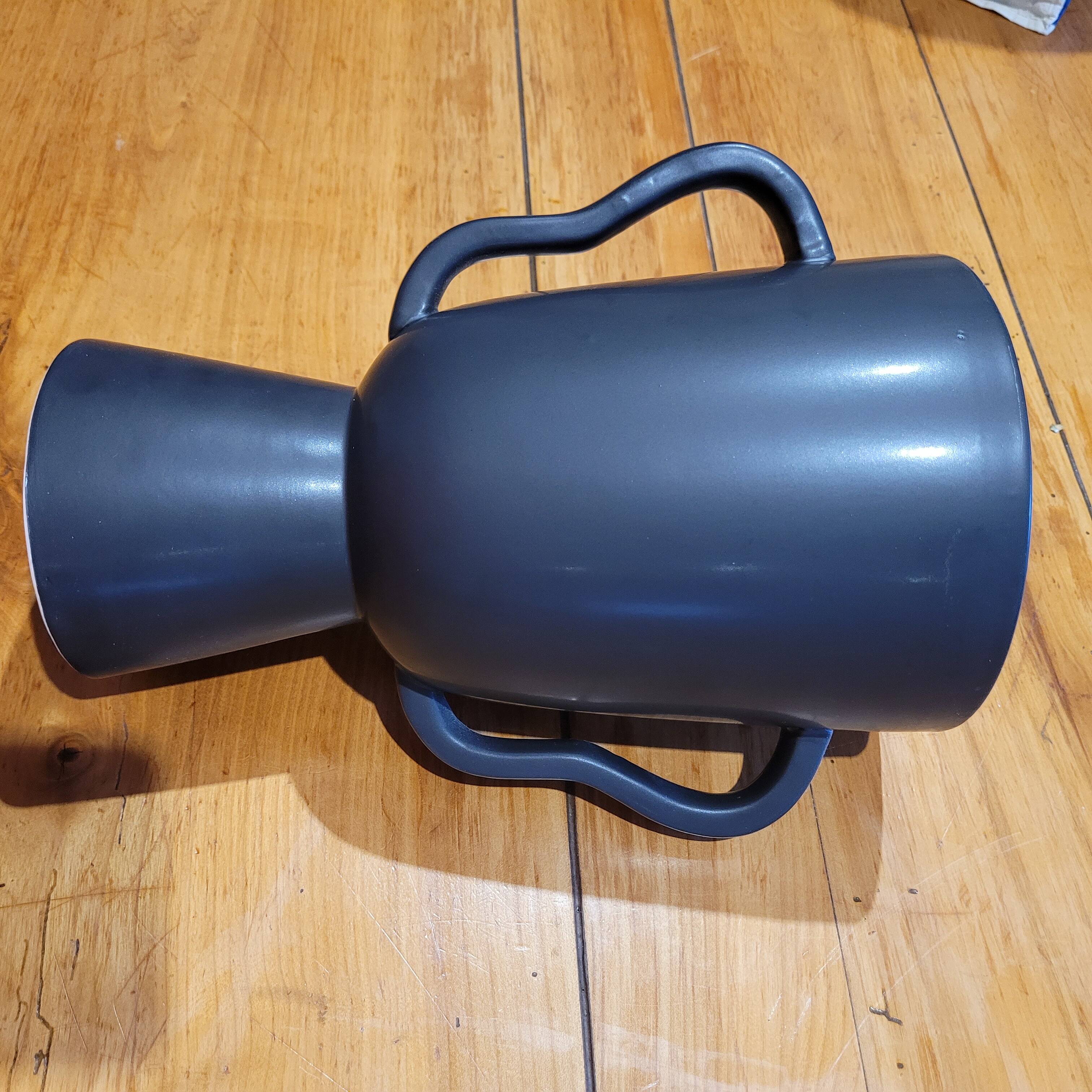 Black tribal face vase