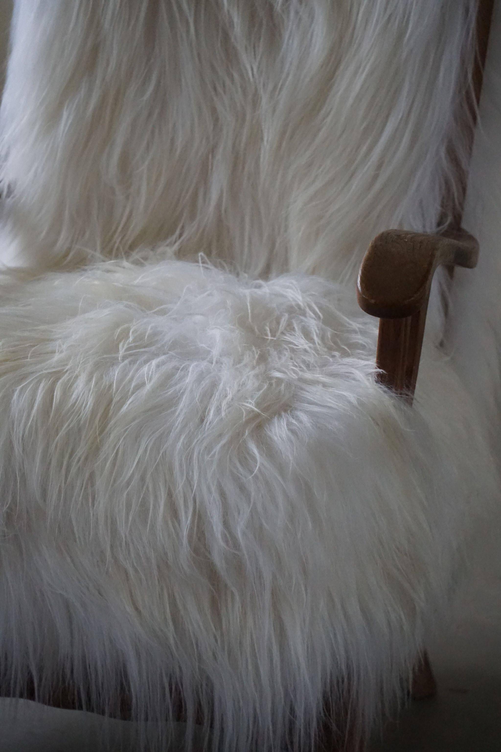 Henning Kjærnulf, armchair reupholstered in long-haired Icelandic sheepskin, 1950