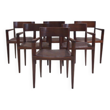 Set of six Italian wooden dining chairs in dark brown faux leather.