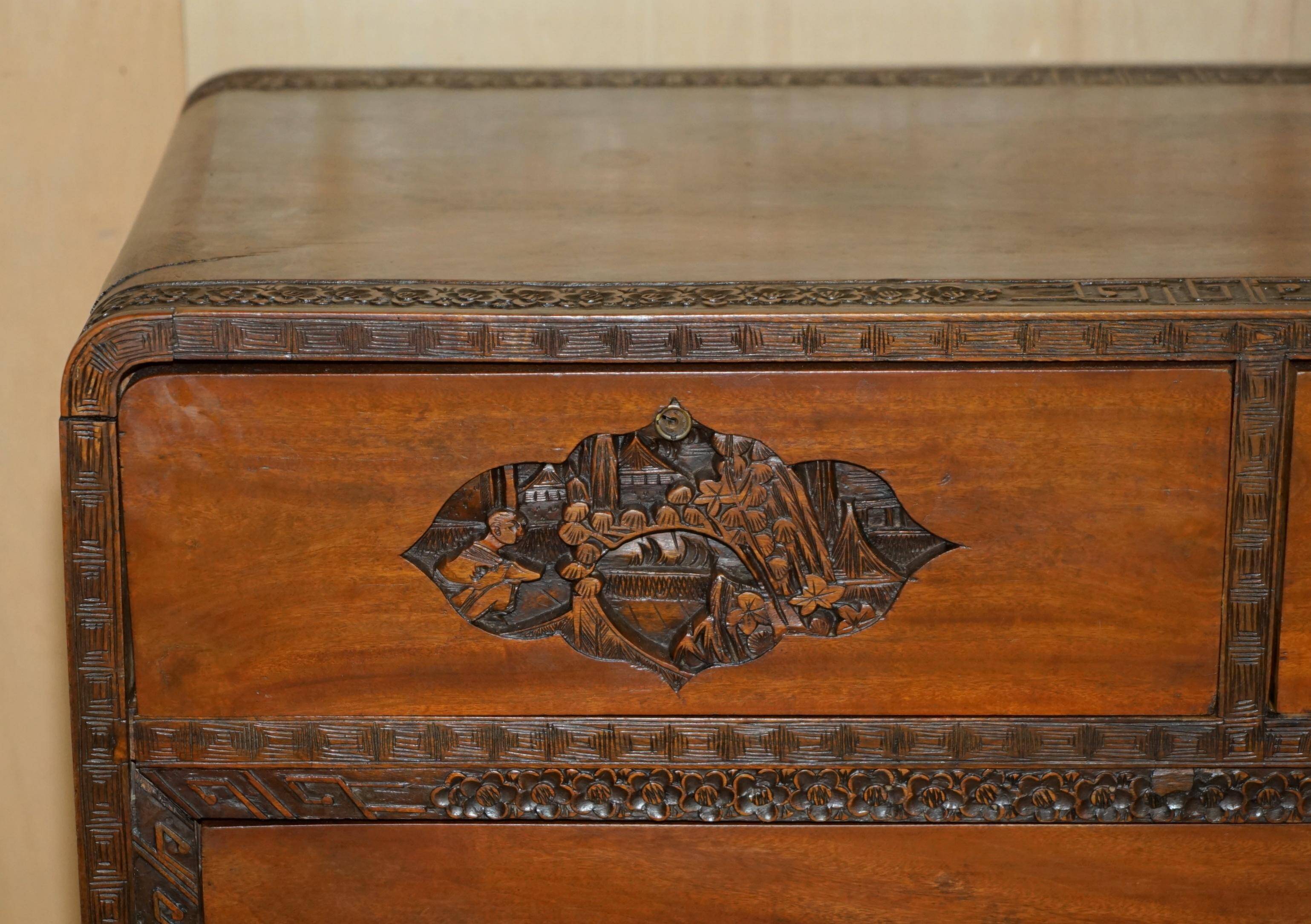 Antique Chinese commode hand-carved circa 1890 with detailed handles.