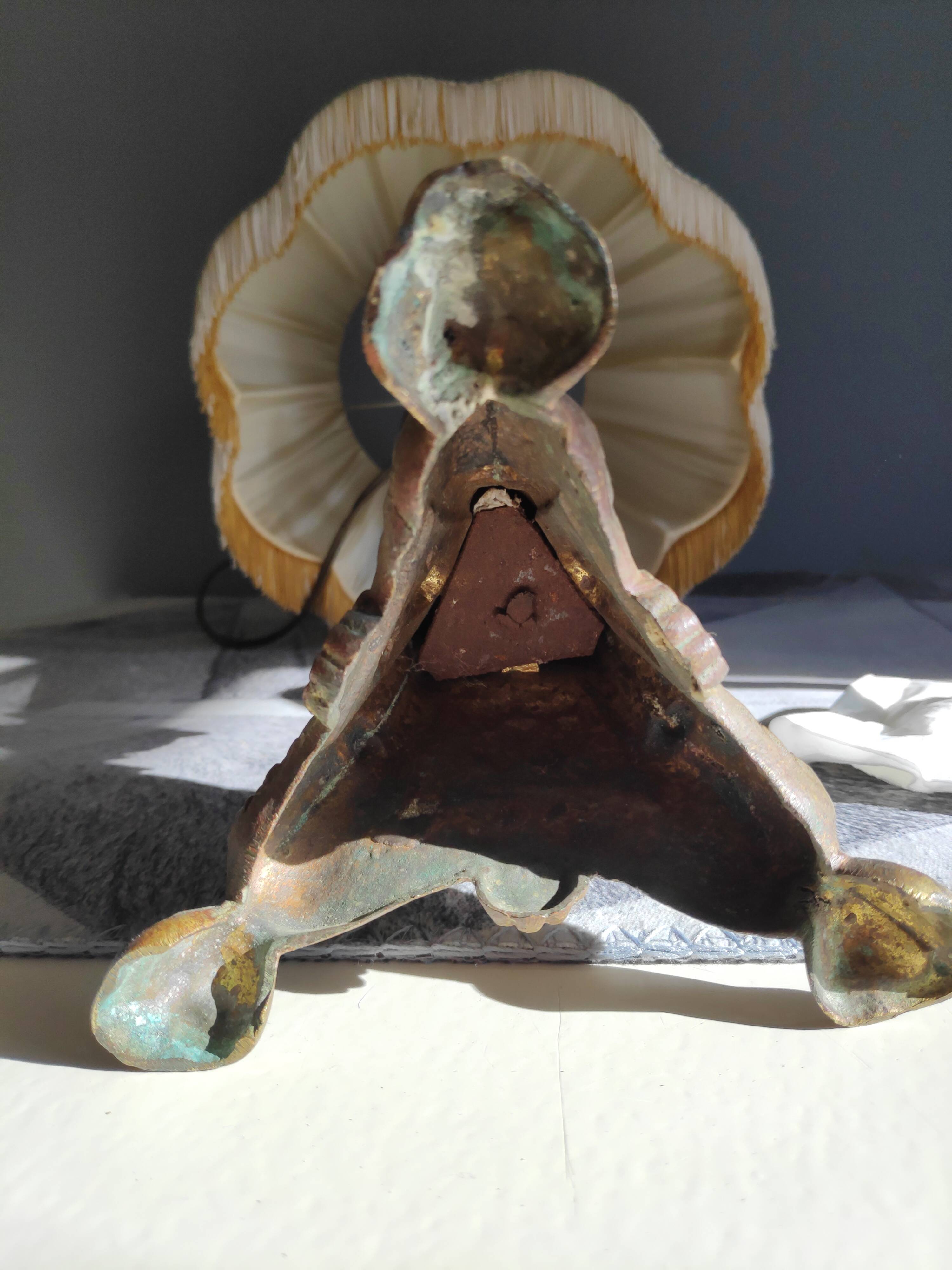 Old brass foot lamp and period lampshade