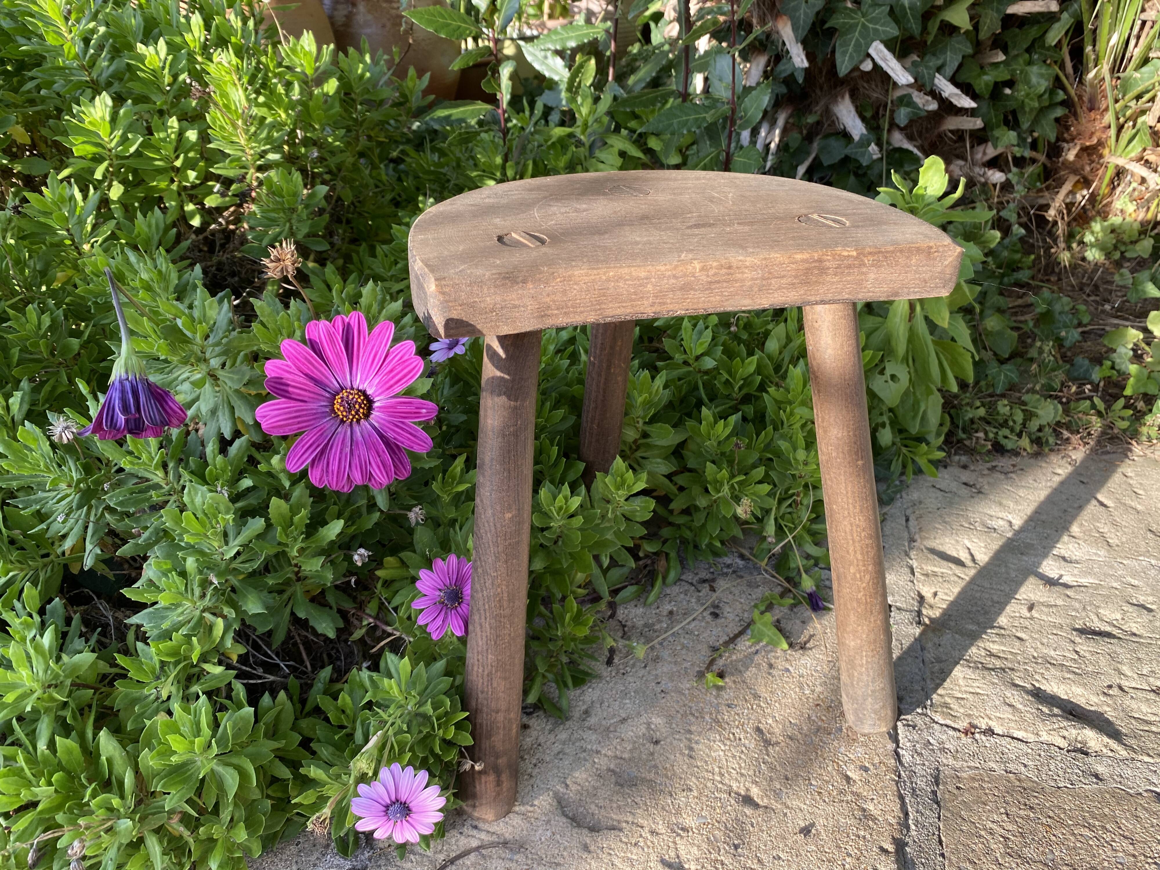 Old wooden tripod stool