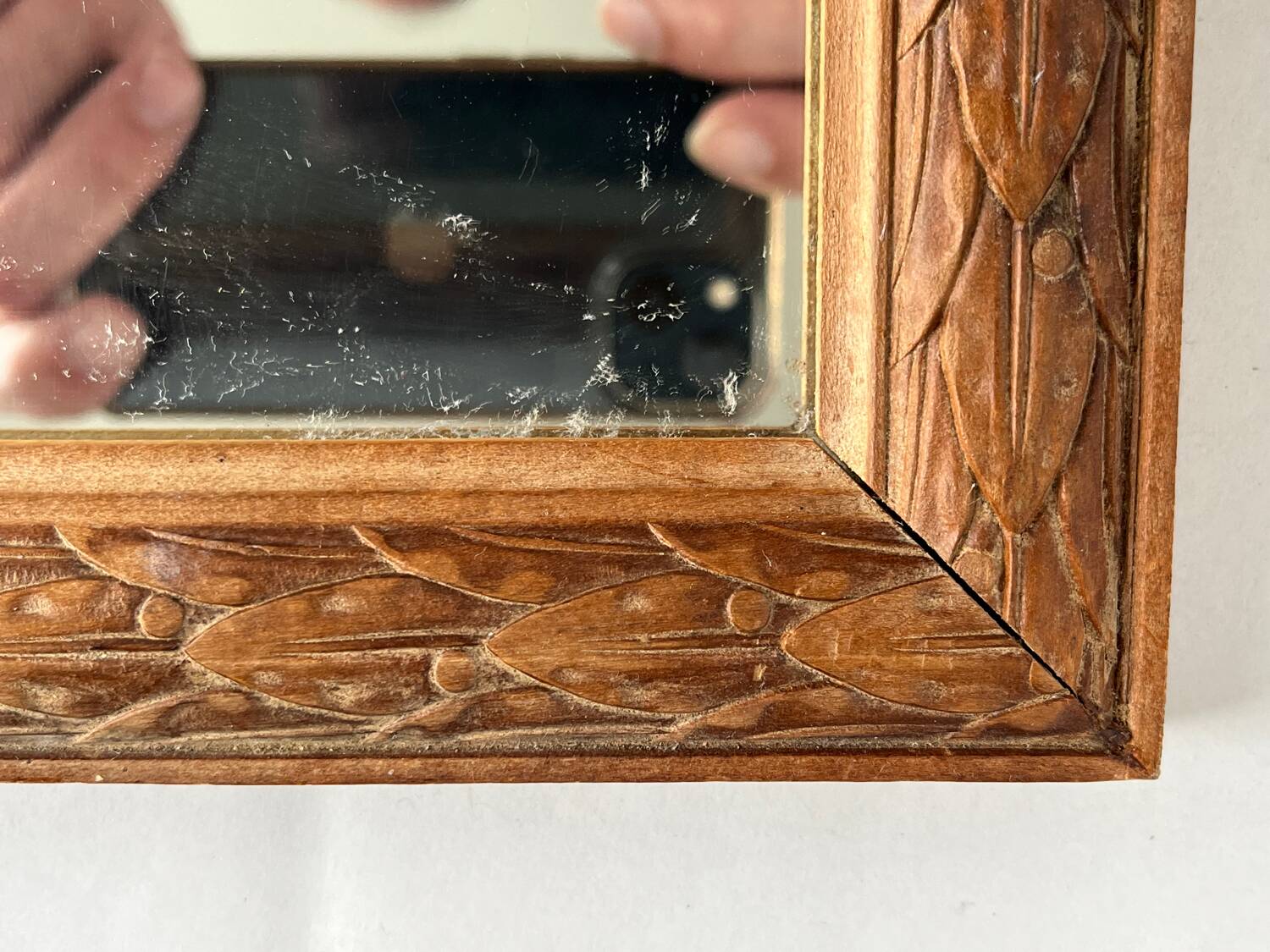 Antique carved wooden mirror