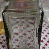 Decorated rectangular glass carafe