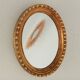 Miroir ovale italien vintage en bois doré